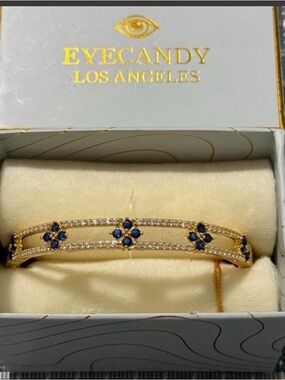 Eye Candy Gold Brass, Cubic Zirconia, Blue Stone Hinged Bangle